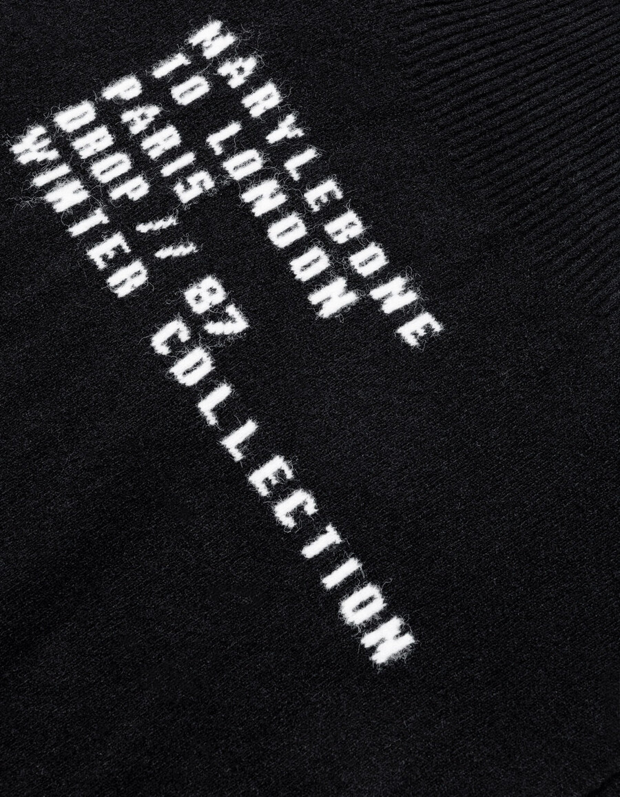 poncho in maglia jacquard con slogan nero da donna