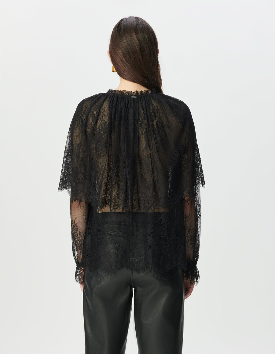 camicetta da donna in pizzo nero con ampie balze