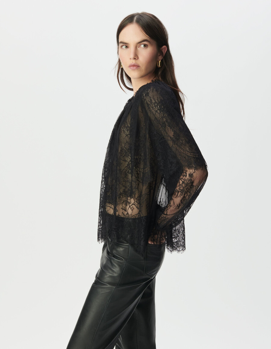 camicetta da donna in pizzo nero con ampie balze