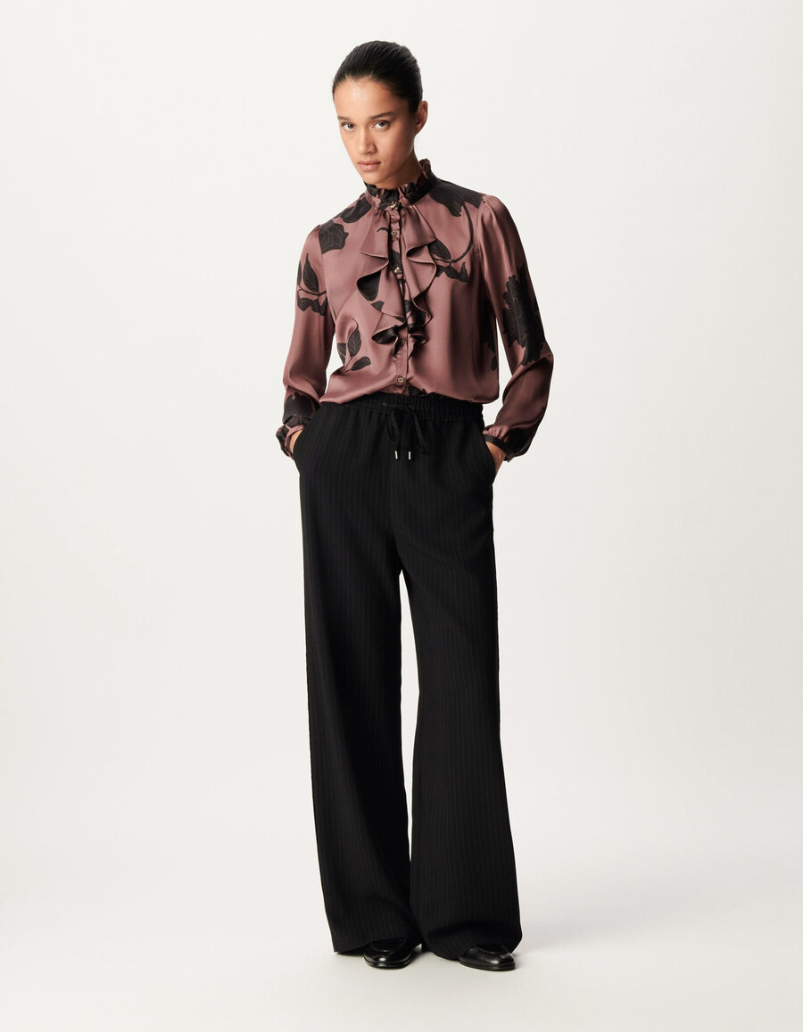 camicia da donna con stampa floreale bordeaux e maxi volant