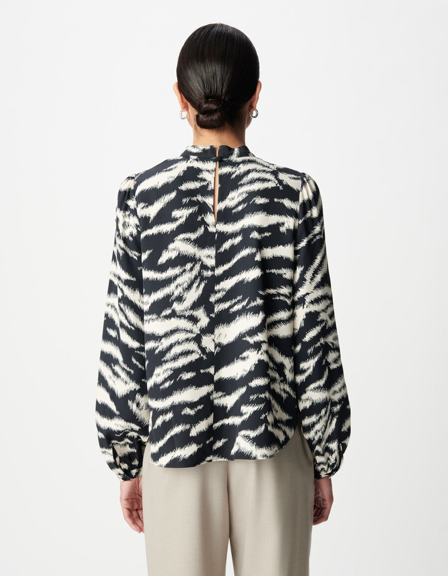 blusa da donna con stampa zebrata nera