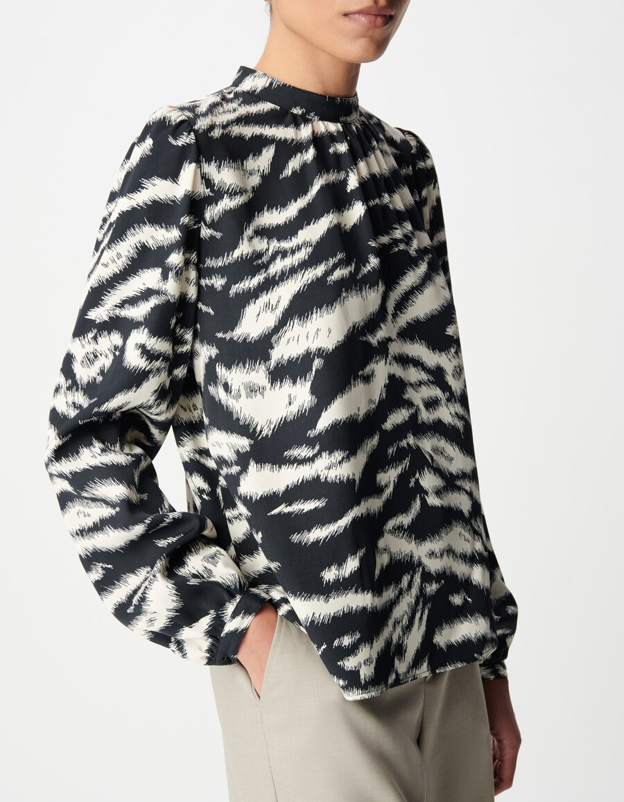 blusa da donna con stampa zebrata nera