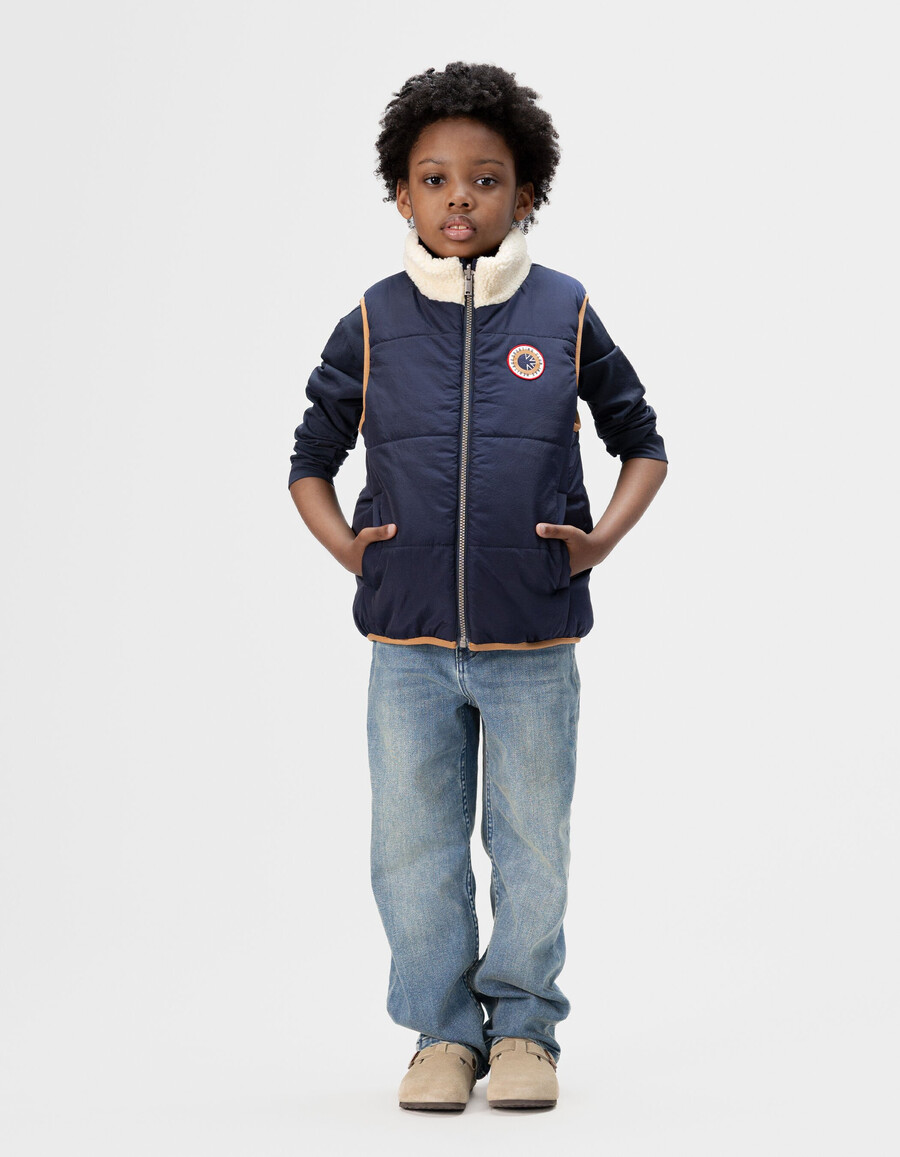 giacca imbottita reversibile senza maniche color écru e blu navy per bambini
