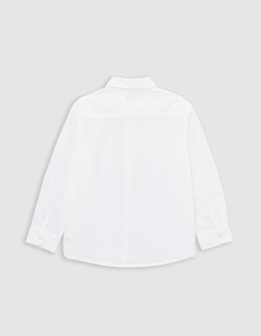 camicia bianca da bambino fulmine ricamato sulla patta dei bottoni