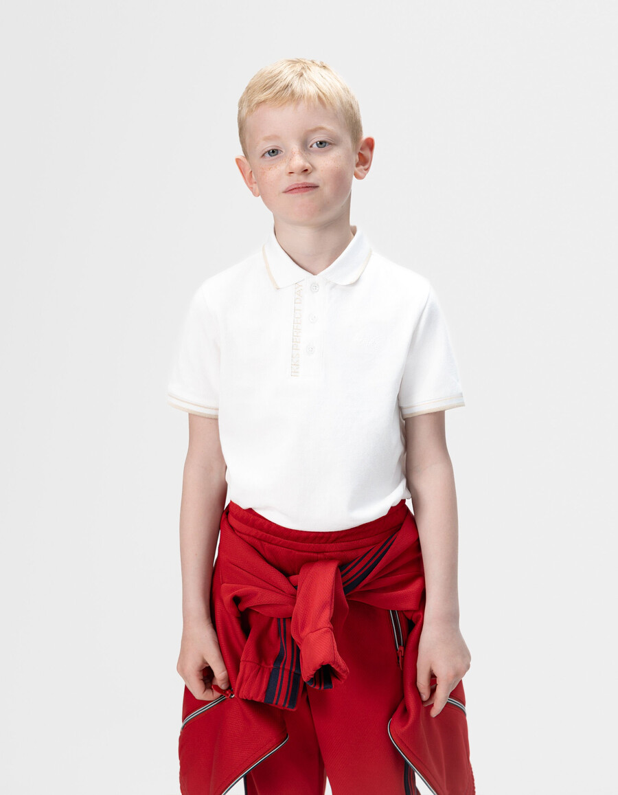 polo bianca in cotone con coste a righe per bambini