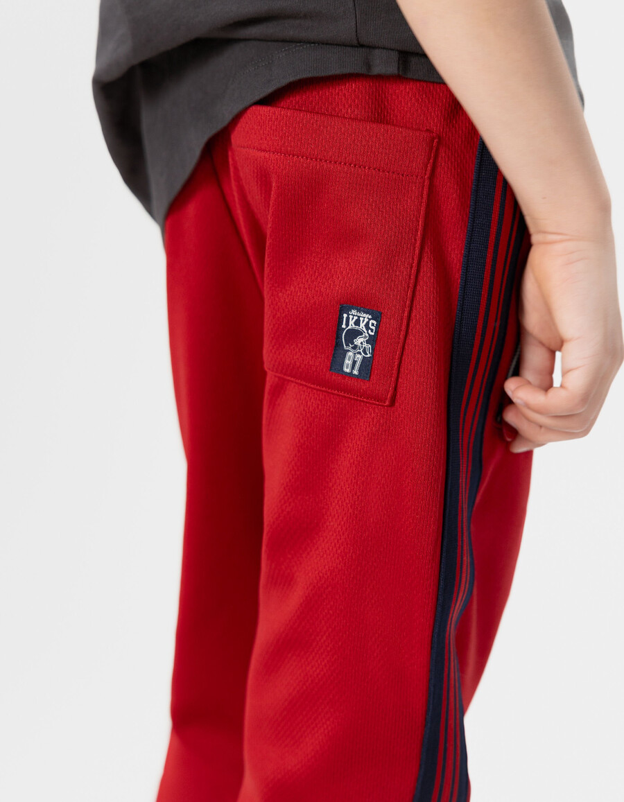 pantaloni da jogging rossi con strisce blu navy per ragazzi