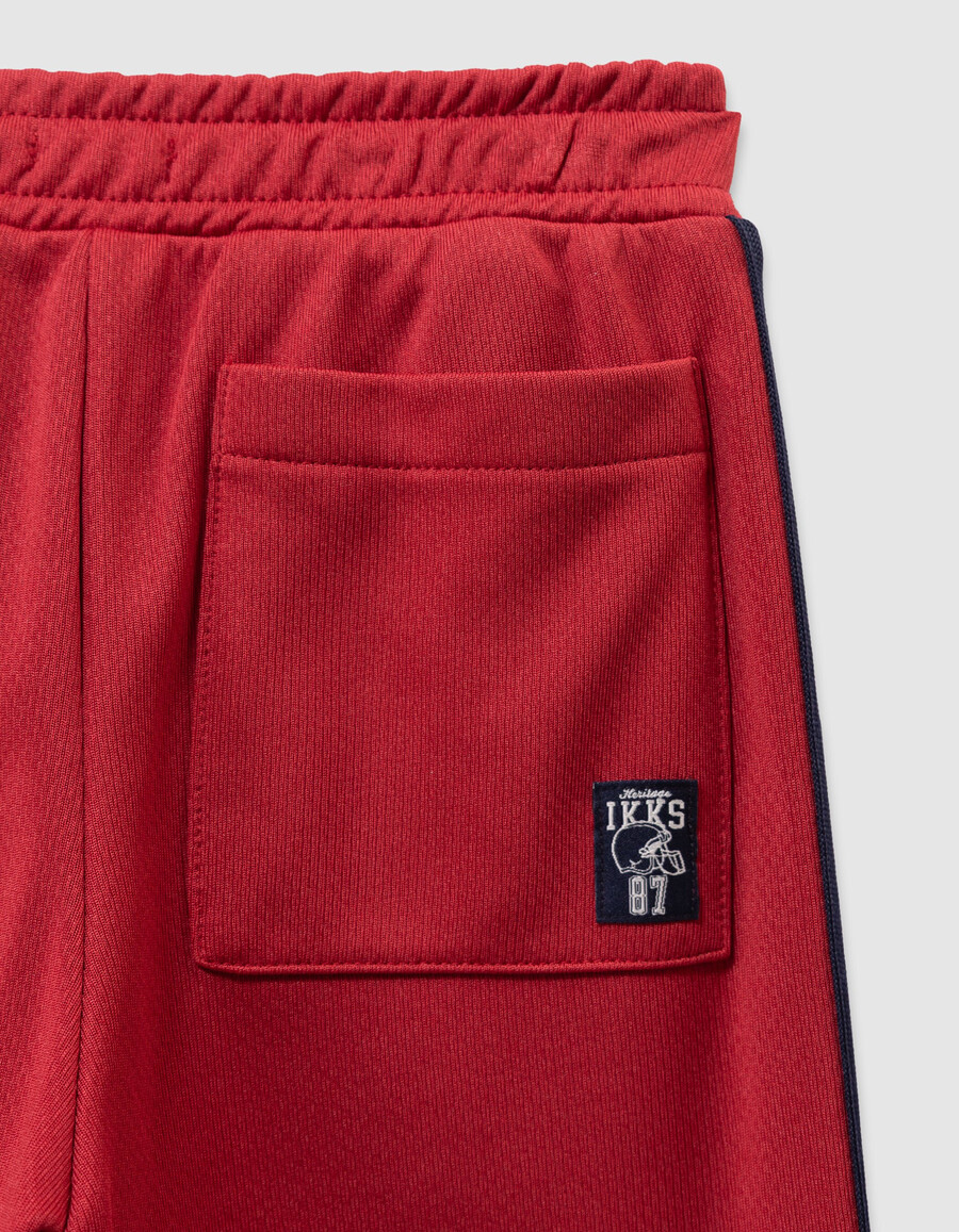pantaloni da jogging rossi con strisce blu navy per ragazzi