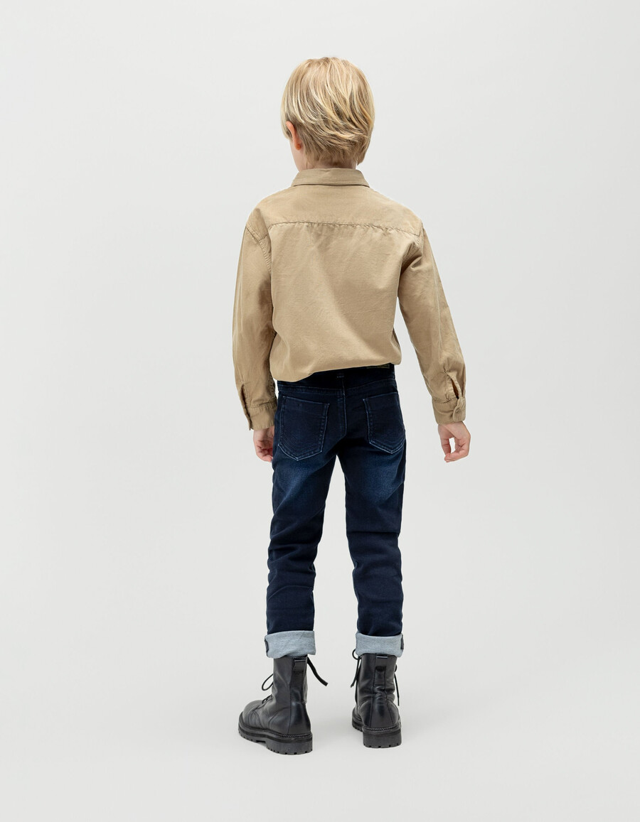 jeans slim blu-neri da ragazzo con impunture a zig-zag
