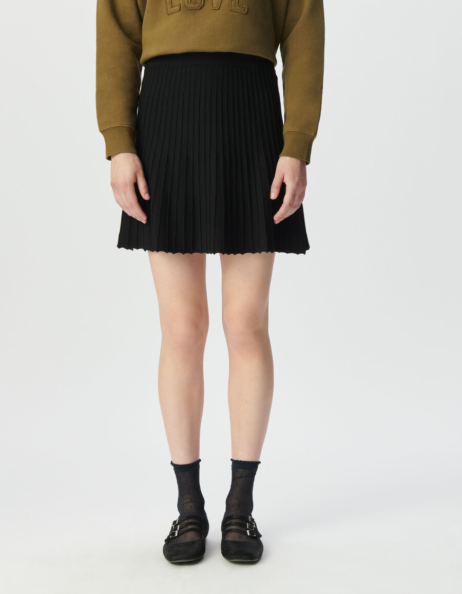 gonna corta plissettata in maglia nera da donna