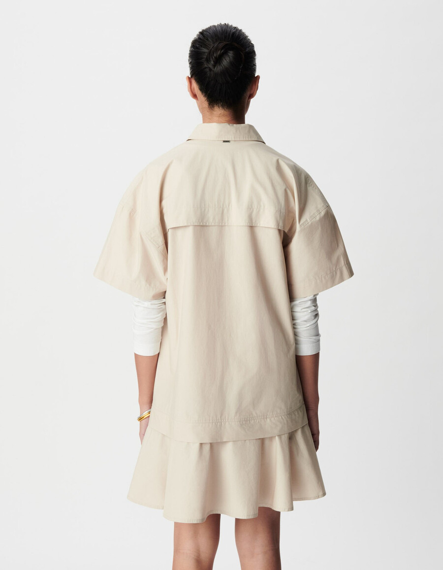 abito corto beige con gonna trompe-loeil da donna