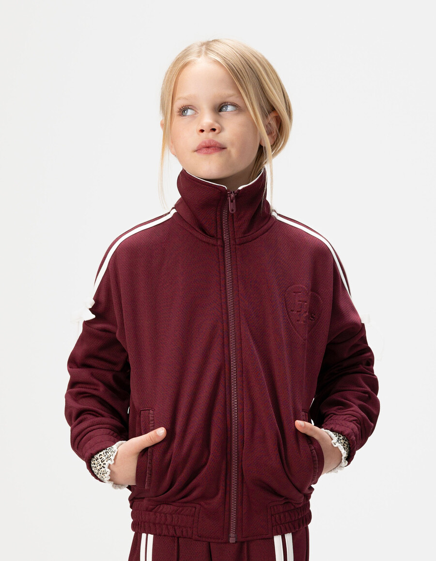 cardigan bordeaux con cerniera e fiocchi ecrù per bambine
