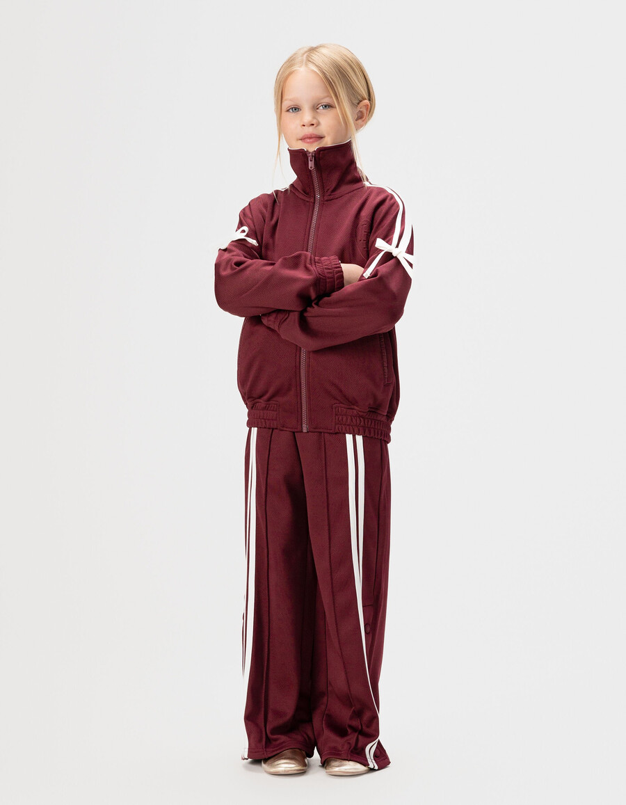 cardigan bordeaux con cerniera e fiocchi ecrù per bambine