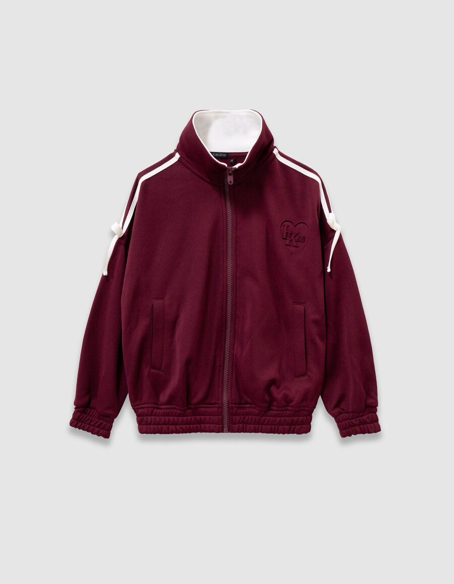 cardigan bordeaux con cerniera e fiocchi ecrù per bambine