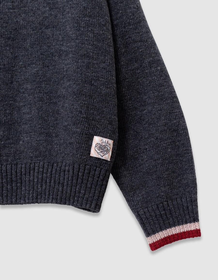 maglione grigio lavorato a maglia per bambine con fiocco xl sulla spalla