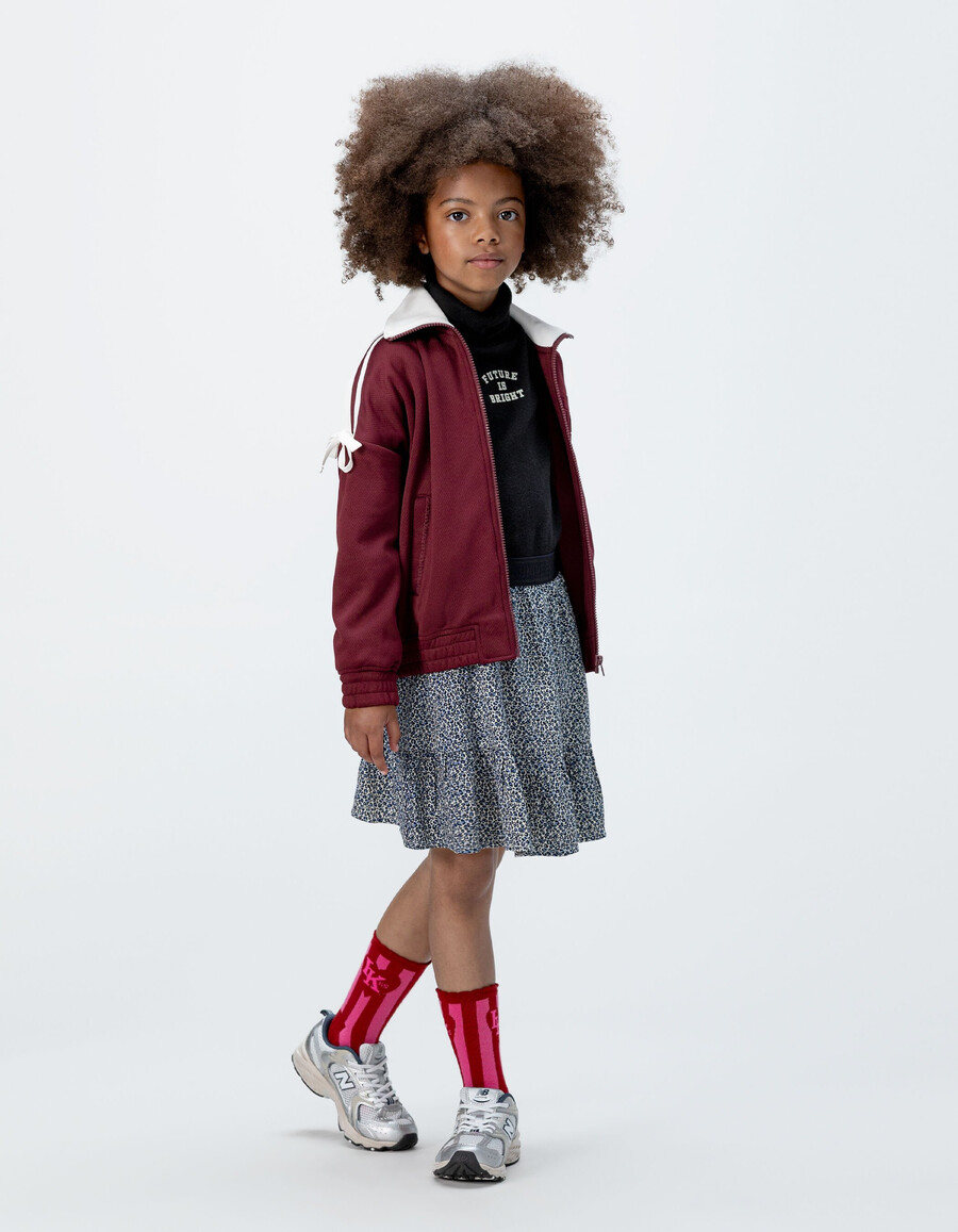 gonna corta blu navy per bambine con stampa leopardata e fiocco
