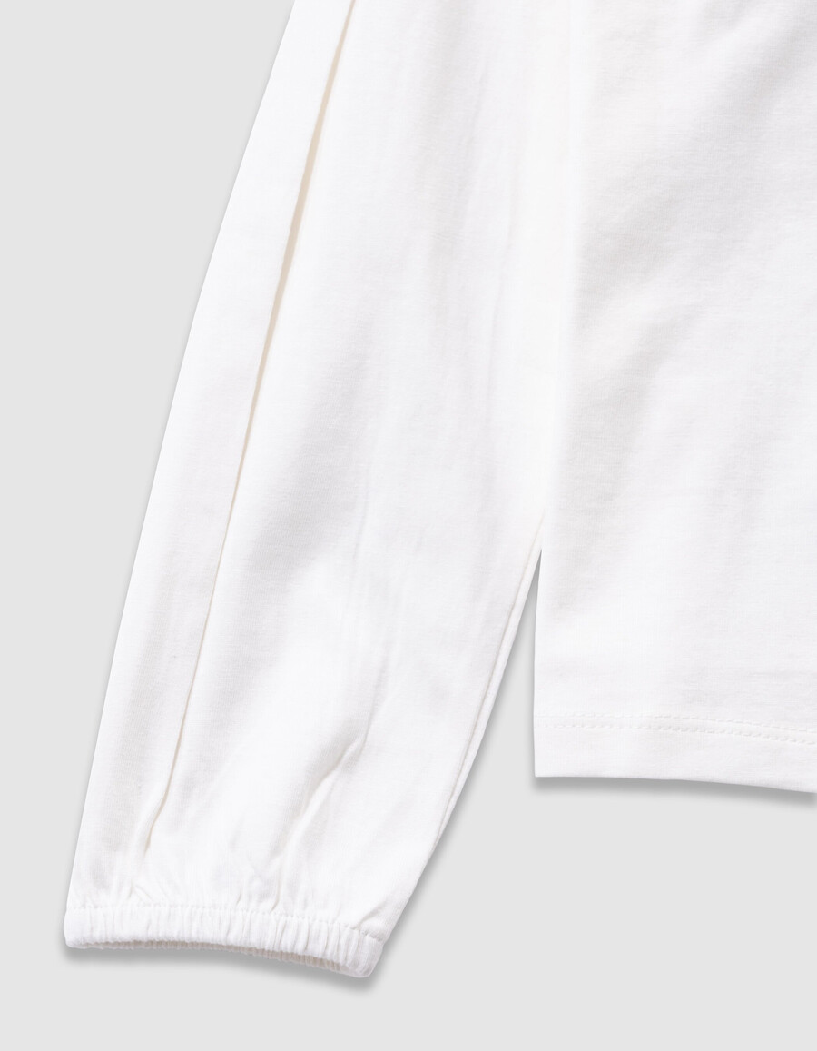 t-shirt da bambina in cotone biologico color écru con coniglio e colletto in pizzo 3d