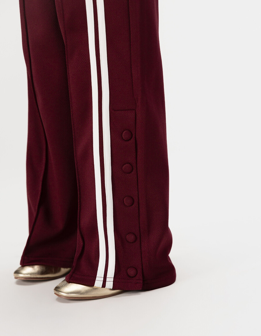 pantaloni da jogging bordeaux con strisce bianche per bambine