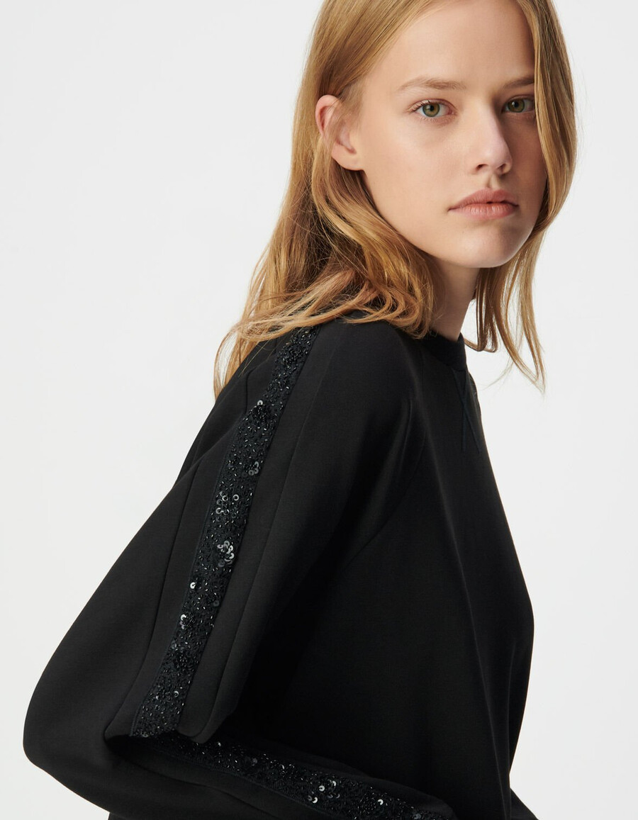 felpa oversize nera da donna bande lungo le maniche