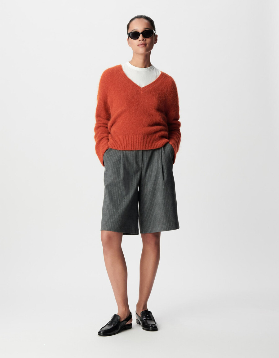 maglione oversize arancione con scollo a v da donna