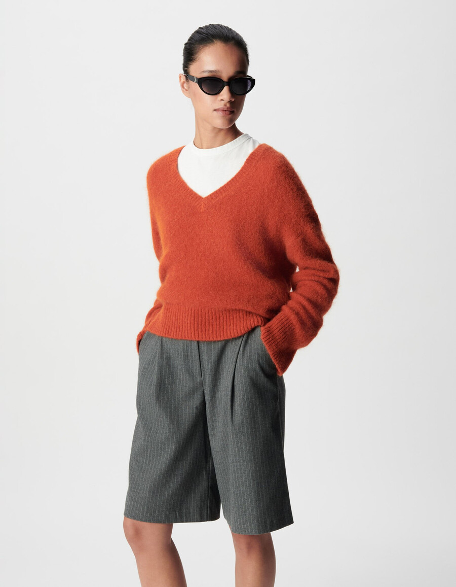 maglione oversize arancione con scollo a v da donna