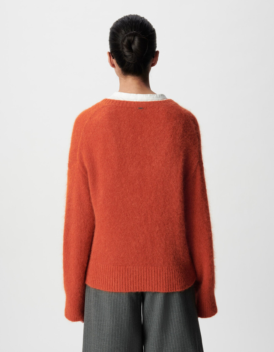 maglione oversize arancione con scollo a v da donna
