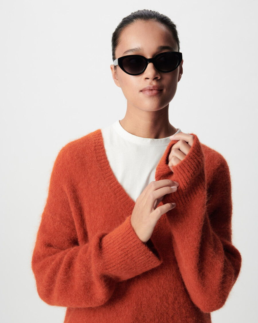 maglione oversize arancione con scollo a v da donna
