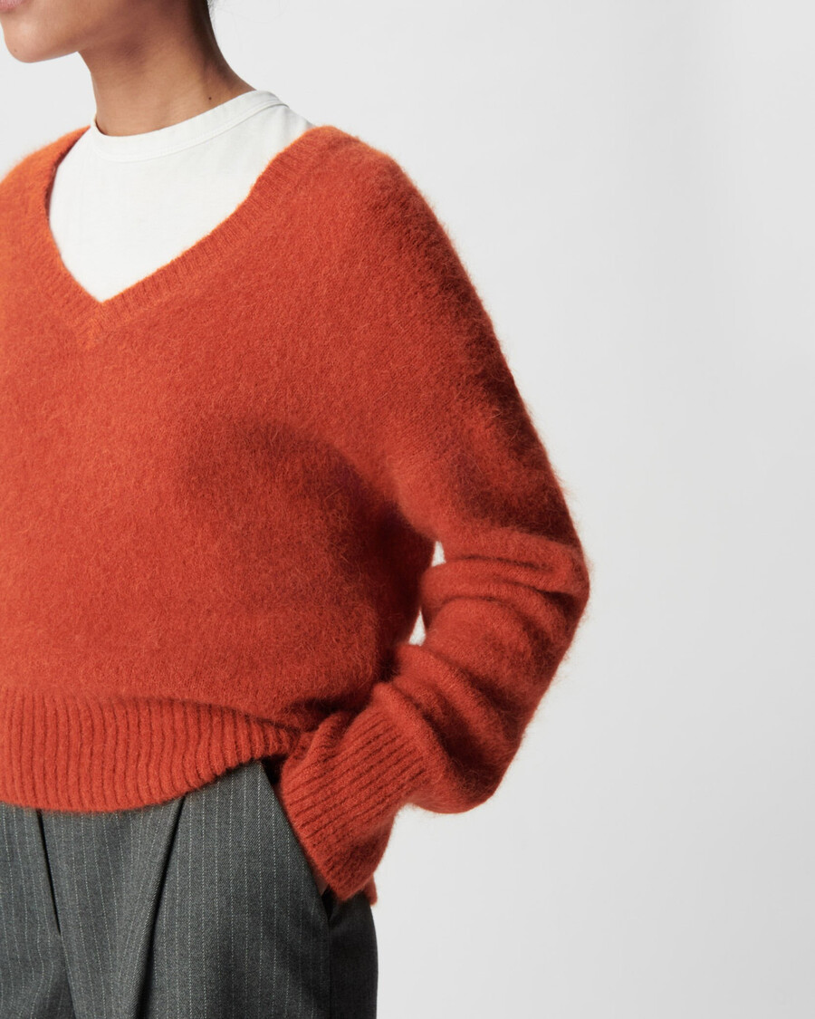 maglione oversize arancione con scollo a v da donna