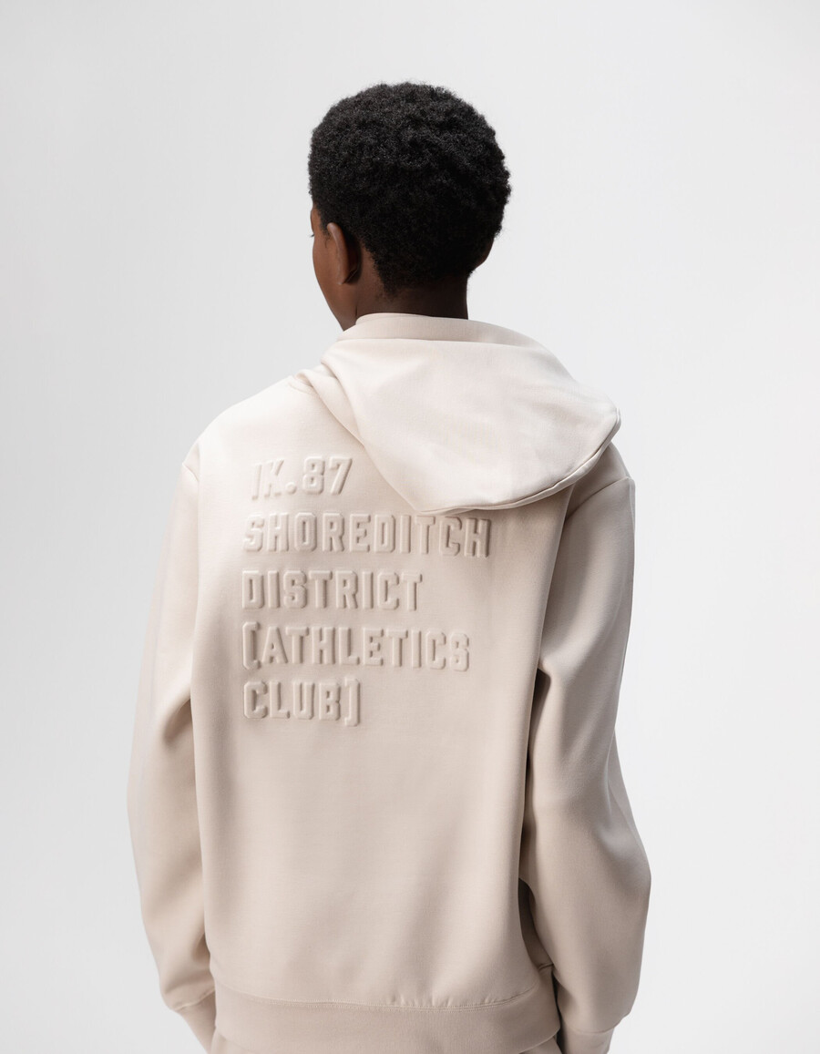 felpa beige da bambino con slogan in rilievo sul retro