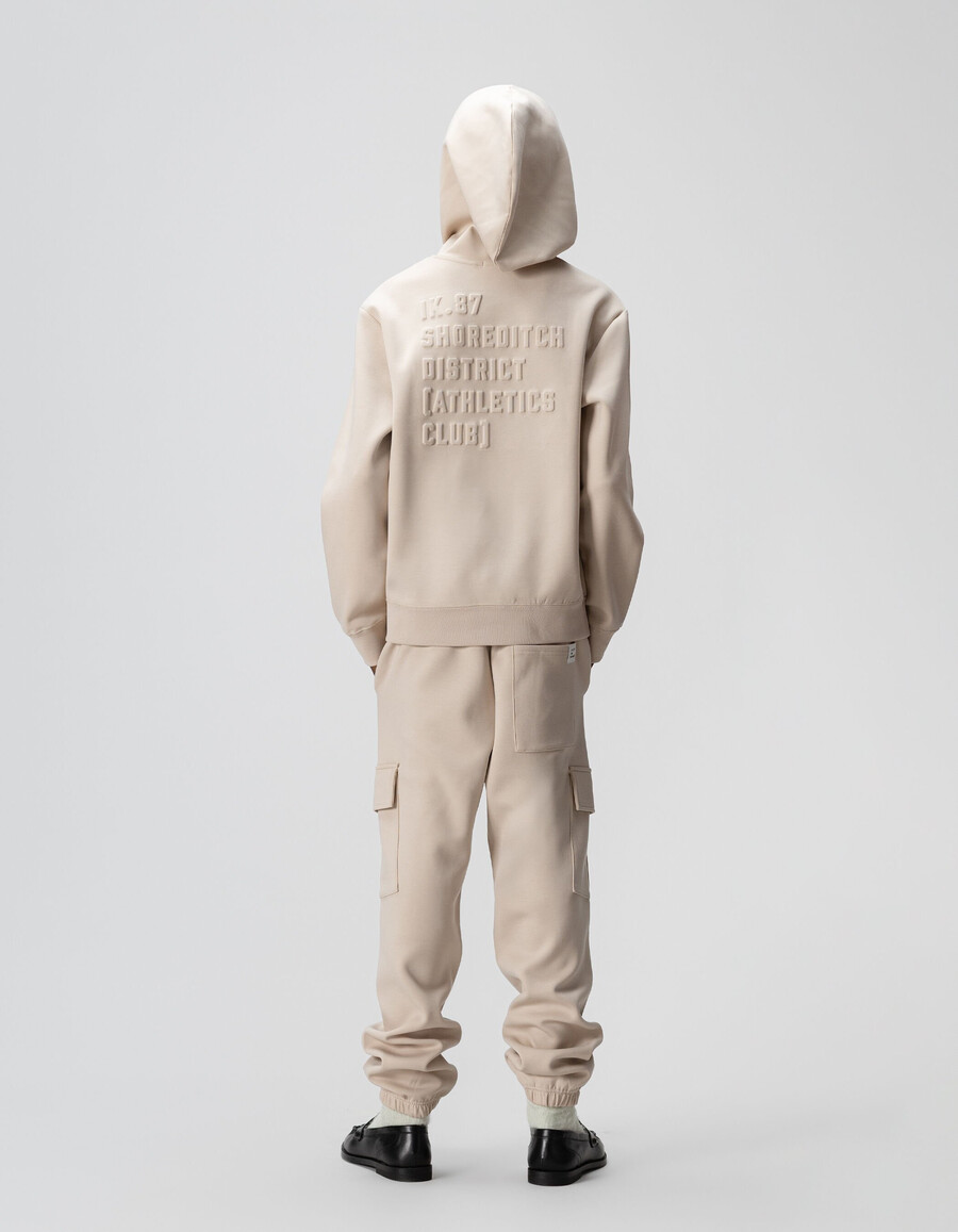 felpa beige da bambino con slogan in rilievo sul retro