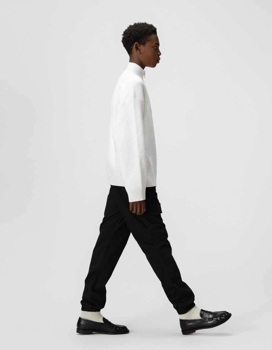 maglione bianco lavorato a maglia con cerniera sul collo per bambini