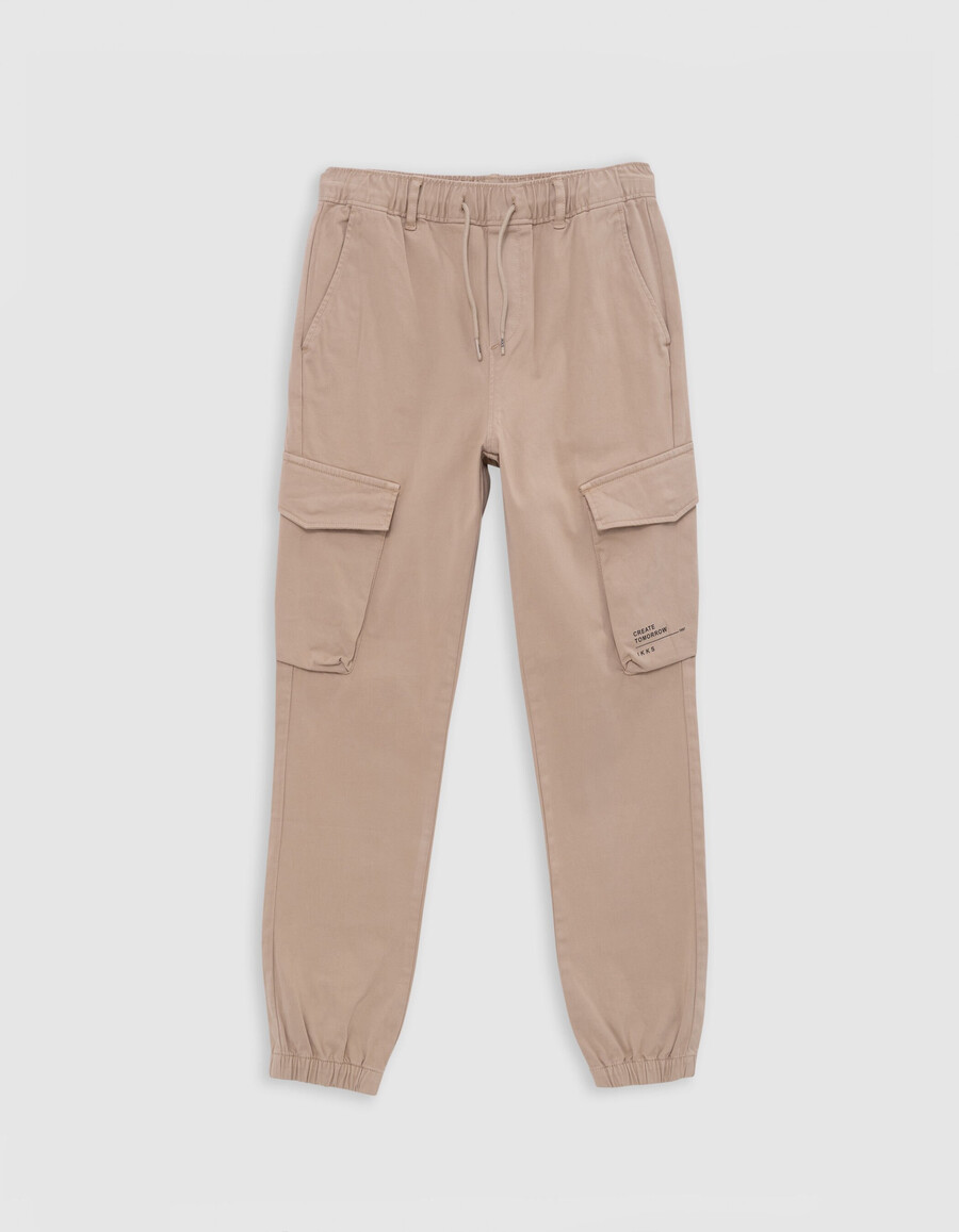pantaloni jogger beige da bambino con elastico in vita