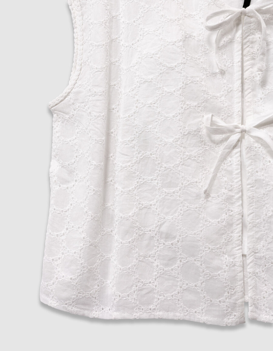 camicia bianca senza maniche in pizzo da annodare sul davanti per bambine