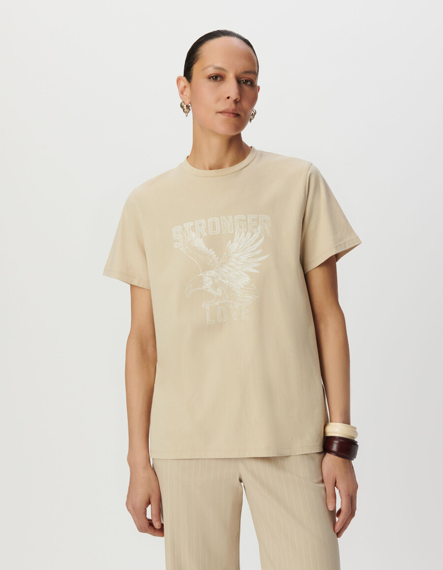 maglietta girocollo da donna in cotone biologico beige con immagine di aquila