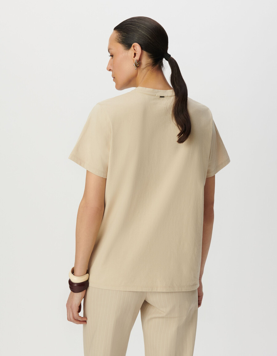 maglietta girocollo da donna in cotone biologico beige con immagine di aquila