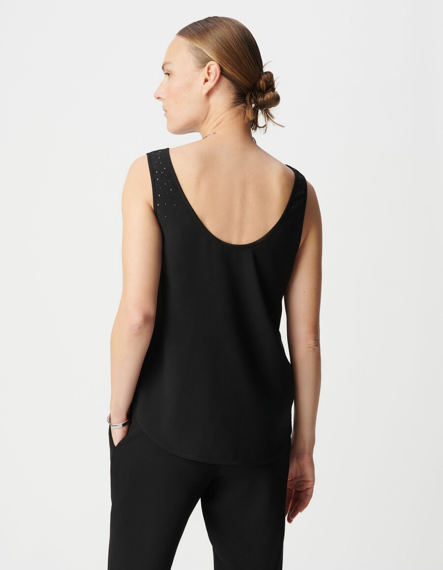 canotta nera reversibile da donna con borchie