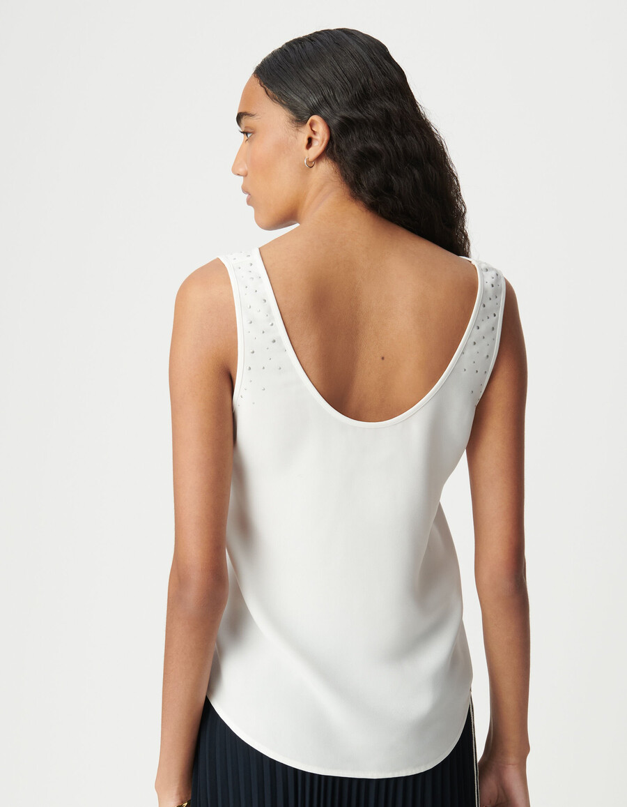 canotta bianca reversibile da donna con borchie