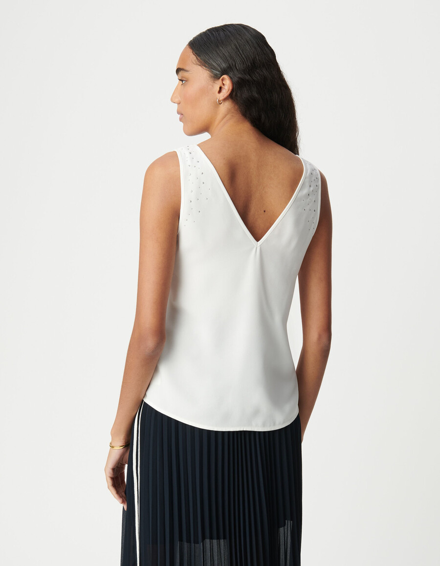 canotta bianca reversibile da donna con borchie