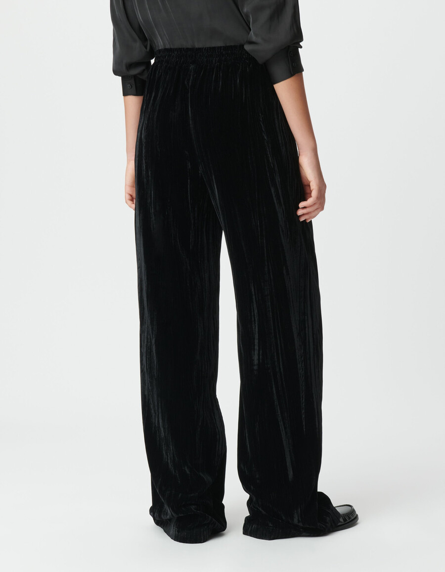 pantaloni a gamba larga in velluto nero stropicciato da donna
