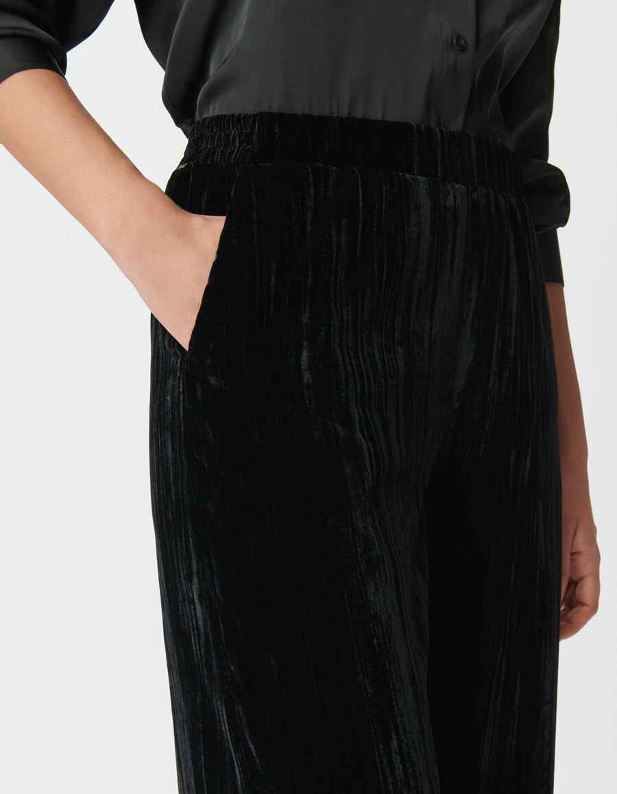 pantaloni a gamba larga in velluto nero stropicciato da donna